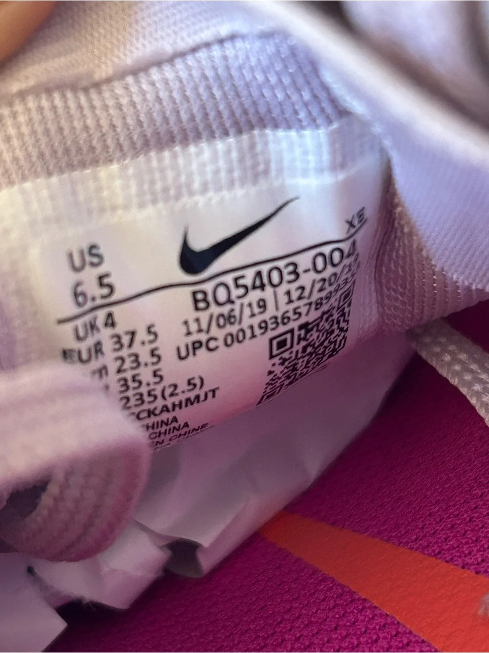 Nike Women's Light Beige Athletic Sneakers with Pink Accents